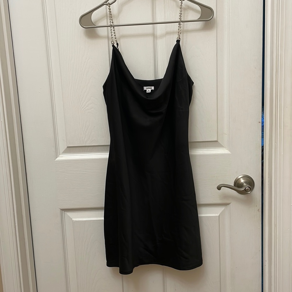Black silk mini dress with diamond rhinestone straps and cowled neck.